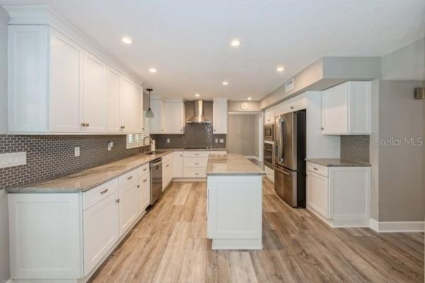 Interior, Kitchen, Pendant Lights, Recessed Lighting, Stainless Steel Appliances, Wood Texture Flooring