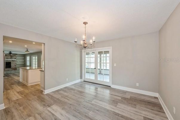 Chandelier, Empty room, Fireplace, Interior, Recessed Lighting, Wood Texture Flooring