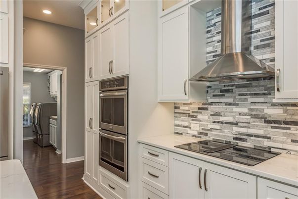 Interior, Kitchen, Recessed Lighting, Stainless Steel Appliances, Washer, Wood Texture Flooring