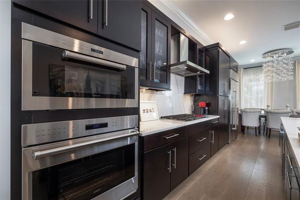 Chandelier, Dining room, Interior, Kitchen, Pendant Lights, Recessed Lighting, Stainless Steel Appliances, Wood Texture Flooring