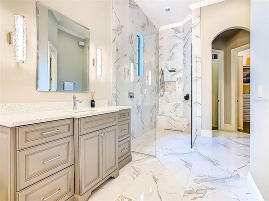 Bathroom, Dual Sink Vanities, Glass Shower, Interior, Marble, Marble Walls, Recessed Lighting