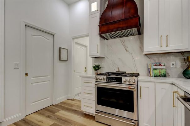 Interior, Kitchen, Marble Walls, Stainless Steel Appliances, Wood Texture Flooring