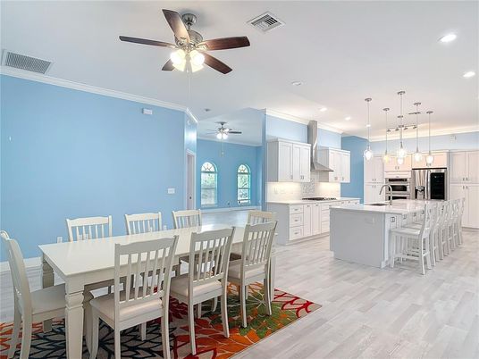 Dining room, Interior, Kitchen, Pendant Lights, Recessed Lighting, Stainless Steel Appliances, Wood Texture Flooring