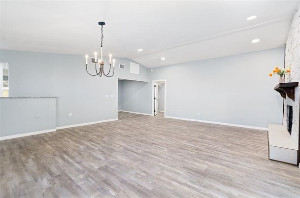 Chandelier, Empty room, Fireplace, Interior, Pendant Lights, Recessed Lighting, Wood Texture Flooring