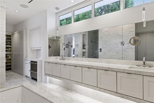 Bathroom, Dual Sink Vanities, Glass Shower, Interior, Marble, Marble Walls, Recessed Lighting
