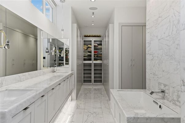 Bathroom, Dual Sink Vanities, Interior, Marble, Marble Walls, Recessed Lighting, Walk-in Closets
