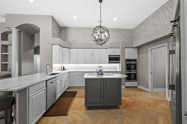 Chandelier, Interior, Kitchen, Pendant Lights, Recessed Lighting, Stainless Steel Appliances, Wood Texture Flooring