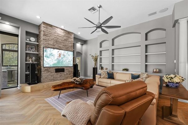 Fireplace, Interior, Living room, Recessed Lighting, Stone Walls, Wood Texture Flooring