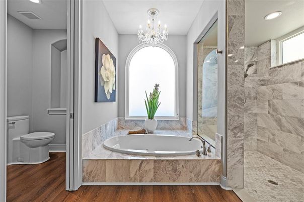 Bathroom, Chandelier, Glass Shower, Interior, Marble Walls, Recessed Lighting, Wood Texture Flooring