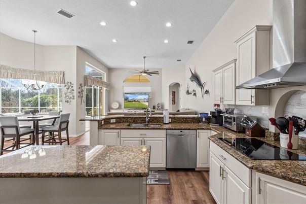 Dining room, Interior, Kitchen, Recessed Lighting, Stainless Steel Appliances, Wood Texture Flooring