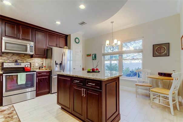 Chandelier, Interior, Kitchen, Pendant Lights, Recessed Lighting, Stainless Steel Appliances, Wood Texture Flooring