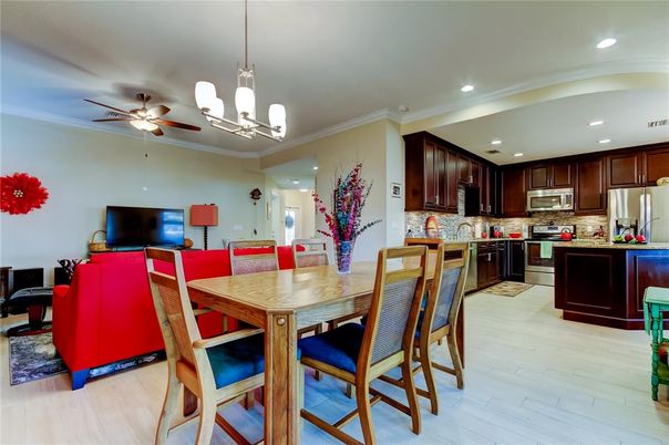 Dining room, Interior, Kitchen, Pendant Lights, Recessed Lighting, Stainless Steel Appliances, Wood Texture Flooring