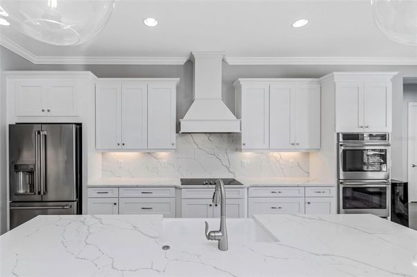 Interior, Kitchen, Marble Walls, Recessed Lighting, Stainless Steel Appliances