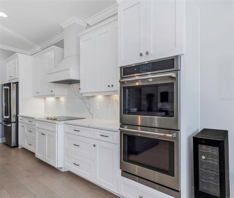 Interior, Kitchen, Marble Walls, Recessed Lighting, Stainless Steel Appliances, Wood Texture Flooring