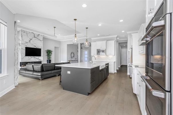 Interior, Kitchen, Marble Walls, Pendant Lights, Recessed Lighting, Stainless Steel Appliances, Wood Texture Flooring