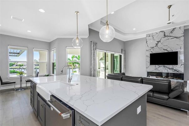 Interior, Kitchen, Marble Walls, Pendant Lights, Recessed Lighting, Stainless Steel Appliances, Wood Texture Flooring