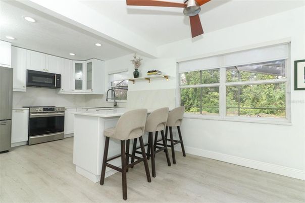 Interior, Kitchen, Recessed Lighting, Stainless Steel Appliances, Wood Texture Flooring