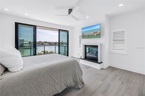 Bedroom, Fireplace, Interior, Recessed Lighting, Water, Wood Texture Flooring