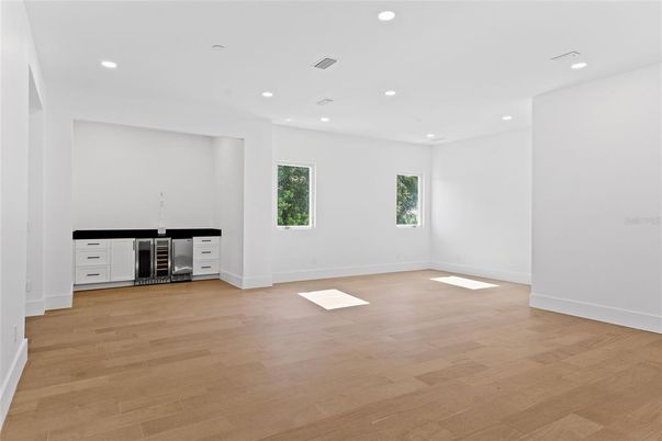 Empty room, Interior, Recessed Lighting, Stainless Steel Appliances, Wood Texture Flooring