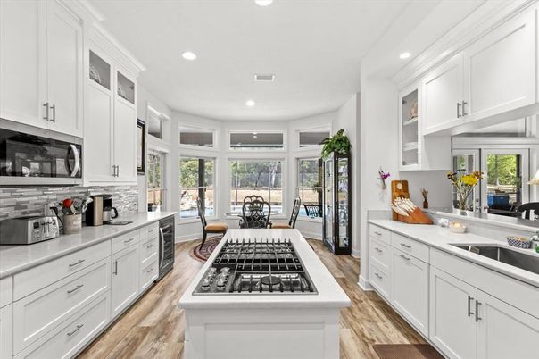 Dining room, Interior, Kitchen, Recessed Lighting, Stainless Steel Appliances, Wood Texture Flooring