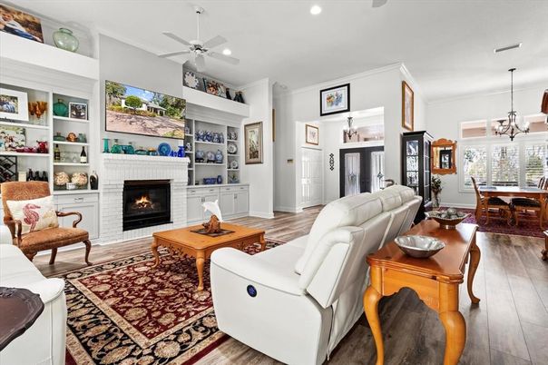 Dining room, Fireplace, Interior, Living room, Pendant Lights, Recessed Lighting, Wood Texture Flooring