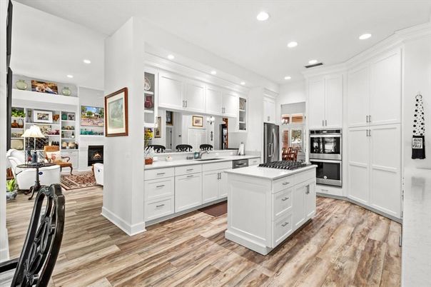Fireplace, Interior, Kitchen, Recessed Lighting, Stainless Steel Appliances, Wood Texture Flooring