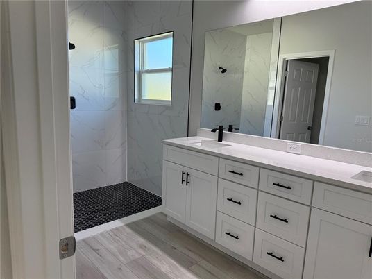 Bathroom, Dual Sink Vanities, Interior, Marble Walls, Wood Texture Flooring
