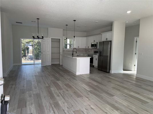 Interior, Kitchen, Pendant Lights, Recessed Lighting, Stainless Steel Appliances, Wood Texture Flooring