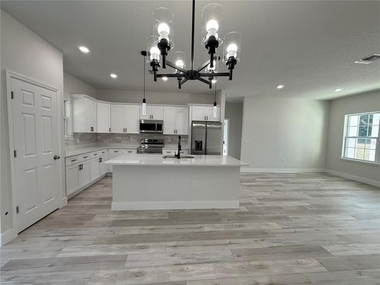 Chandelier, Interior, Kitchen, Pendant Lights, Recessed Lighting, Stainless Steel Appliances, Wood Texture Flooring