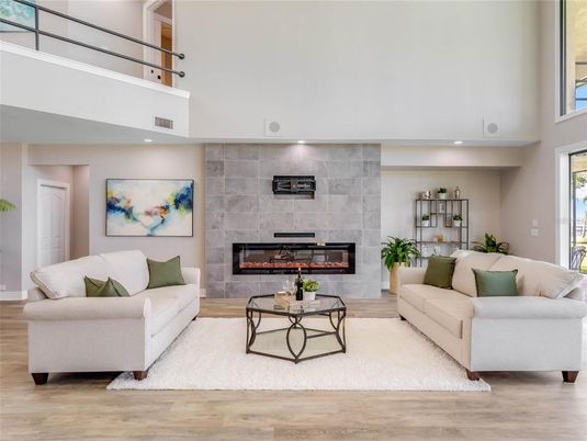 Fireplace, Interior, Living room, Recessed Lighting, Stone Walls, Wood Texture Flooring