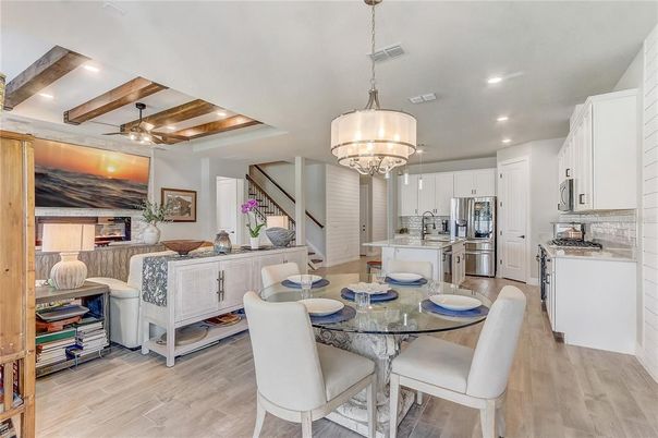 Chandelier, Dining room, Interior, Kitchen, Living room, Pendant Lights, Recessed Lighting, Stainless Steel Appliances, Wooden Beams, Wood Texture Flooring
