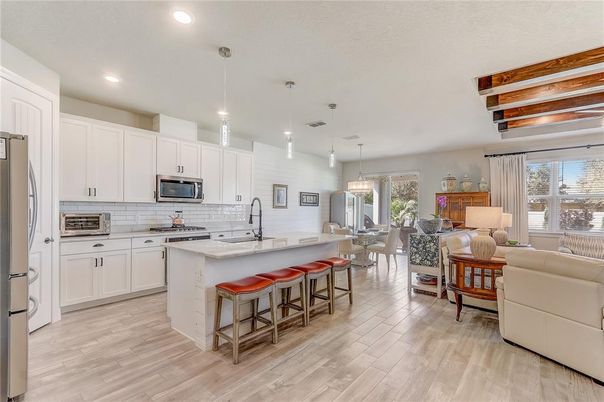 Dining room, Interior, Kitchen, Living room, Pendant Lights, Recessed Lighting, Stainless Steel Appliances, Wooden Beams, Wood Texture Flooring