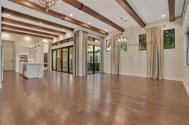Empty room, Interior, Kitchen, Pendant Lights, Recessed Lighting, Stainless Steel Appliances, Wooden Beams, Wood Texture Flooring