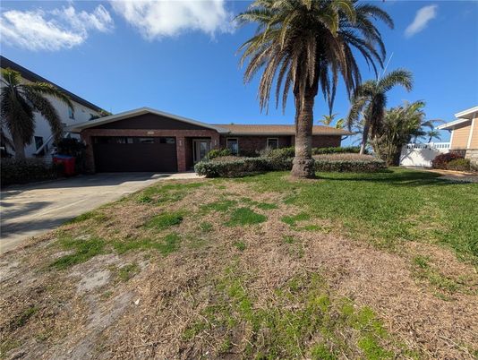 Attached, Backyard, Exterior, Facade, Brick Facade, Ranch