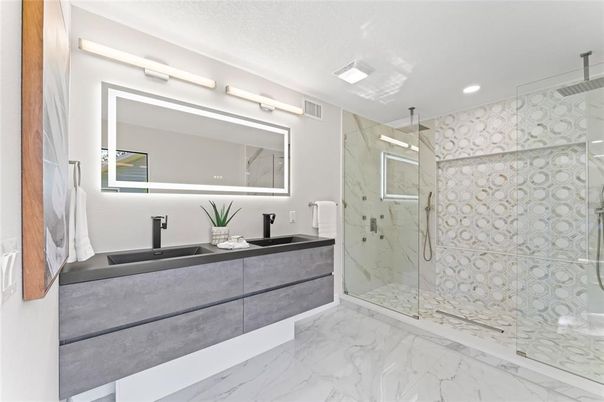 Bathroom, Dual Sink Vanities, Glass Shower, Interior, Marble, Marble Walls, Recessed Lighting