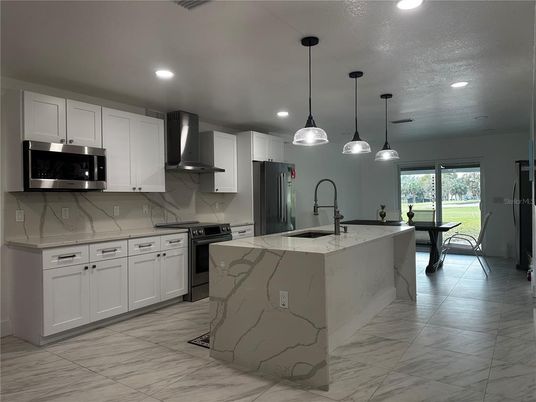 Interior, Kitchen, Marble, Marble Walls, Pendant Lights, Recessed Lighting, Stainless Steel Appliances