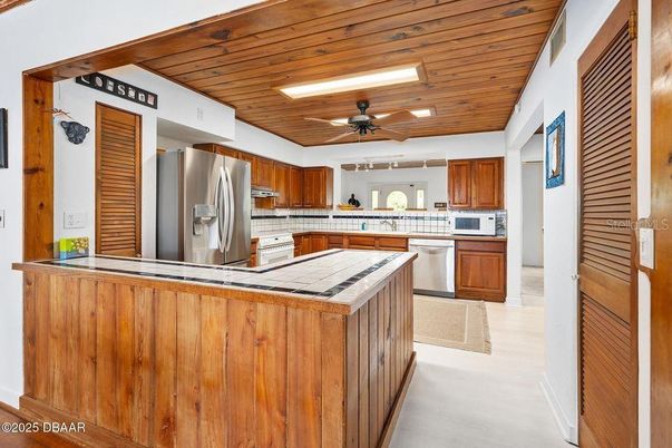 Interior, Kitchen, Recessed Lighting, Stainless Steel Appliances, Tile Countertops, Wooden Ceilings