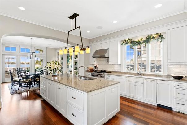Chandelier, Dining room, Interior, Kitchen, Pendant Lights, Recessed Lighting, Stainless Steel Appliances, Wood Texture Flooring