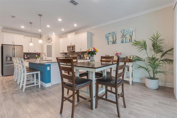 Dining room, Interior, Kitchen, Pendant Lights, Recessed Lighting, Stainless Steel Appliances, Wood Texture Flooring
