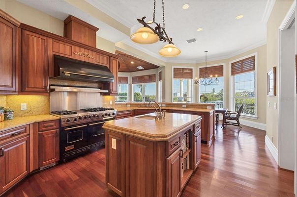 Chandelier, Dining room, Interior, Kitchen, Pendant Lights, Recessed Lighting, Stainless Steel Appliances, Wood Texture Flooring