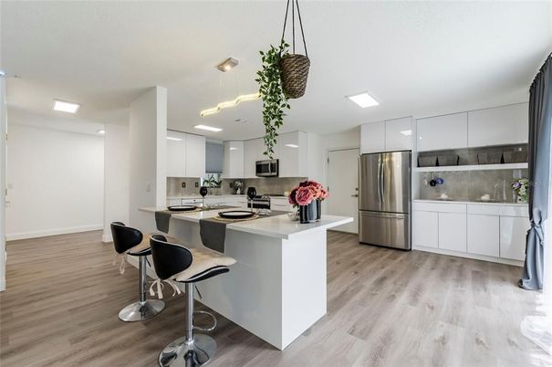 Interior, Kitchen, Pendant Lights, Recessed Lighting, Stainless Steel Appliances, Wood Texture Flooring