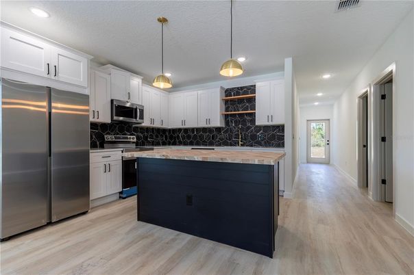 Interior, Kitchen, Pendant Lights, Recessed Lighting, Stainless Steel Appliances, Wood Texture Flooring