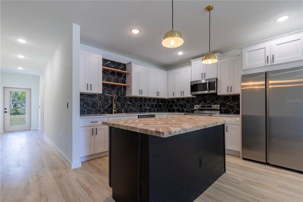Interior, Kitchen, Pendant Lights, Recessed Lighting, Stainless Steel Appliances, Wood Texture Flooring