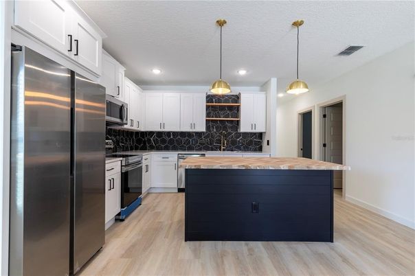 Interior, Kitchen, Pendant Lights, Recessed Lighting, Stainless Steel Appliances, Wood Texture Flooring