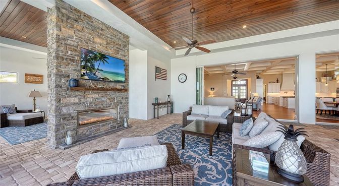 Dining room, Fireplace, Interior, Living room, Recessed Lighting, Stone Walls, Wooden Ceilings
