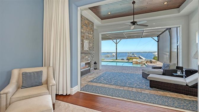 Fireplace, Interior, Living room, Recessed Lighting, Stone Walls, Water, Wooden Ceilings, Wood Texture Flooring