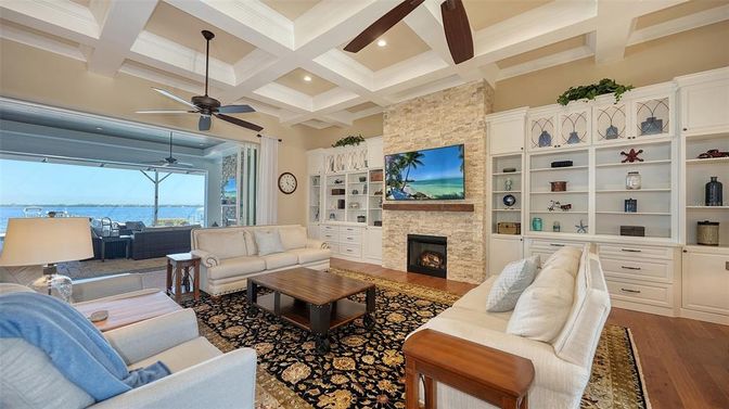 Fireplace, Interior, Living room, Recessed Lighting, Stone Walls, Water, Wood Texture Flooring