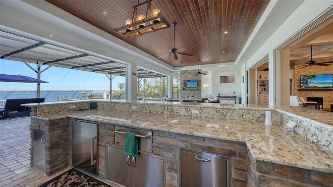 Fireplace, Interior, Recessed Lighting, Stone Walls, Water, Wooden Ceilings
