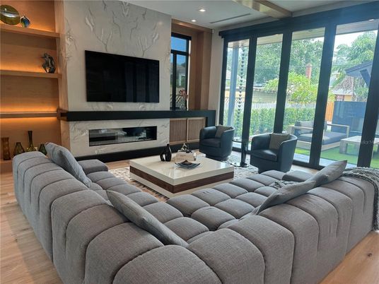 Fireplace, Interior, Living room, Marble Walls, Recessed Lighting, Wood Texture Flooring