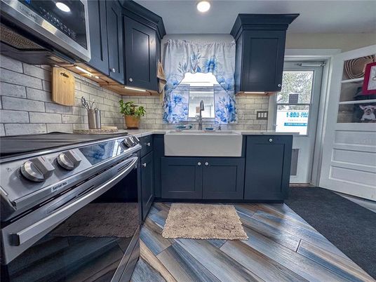 Interior, Kitchen, Recessed Lighting, Stainless Steel Appliances, Stone Walls, Wood Texture Flooring